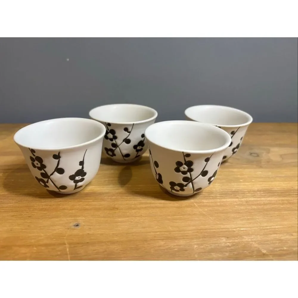 White ceramic tea pot and 4 tea cups with black cherry blossoms
